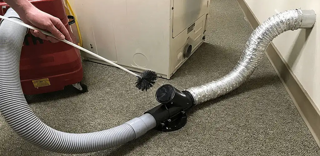 Dryer vent cleaning service removing lint from a dryer duct connection in Pembroke Pines, FL