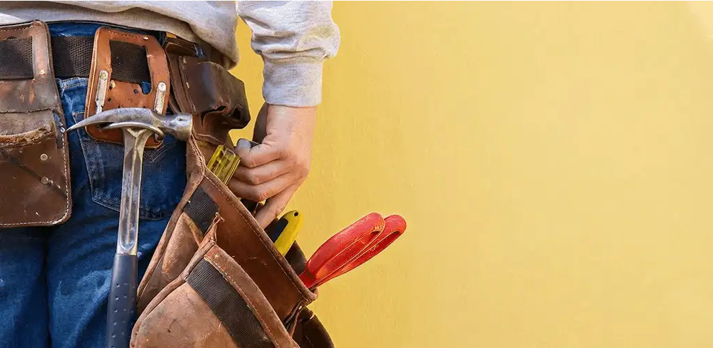Handyman with tool belt ready for home repairs and maintenance in Pembroke Pines, FL