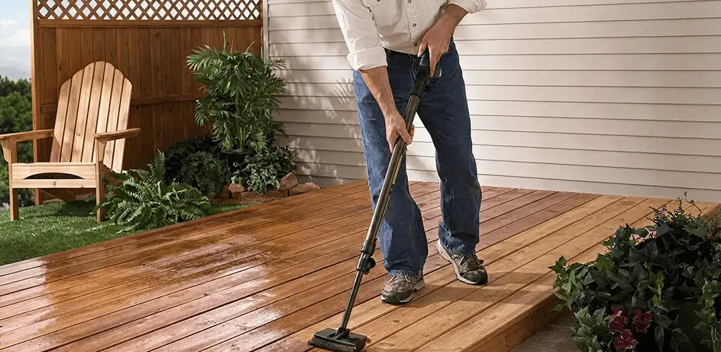 Deck staining service applying stain to a backyard wood deck in Pembroke Pines, FL